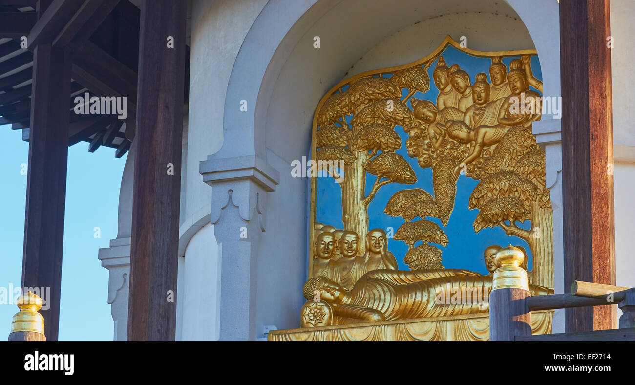 Golden sleeping Buddha statue Battersea Park Peace Pagoda London England Europe Stock Photo