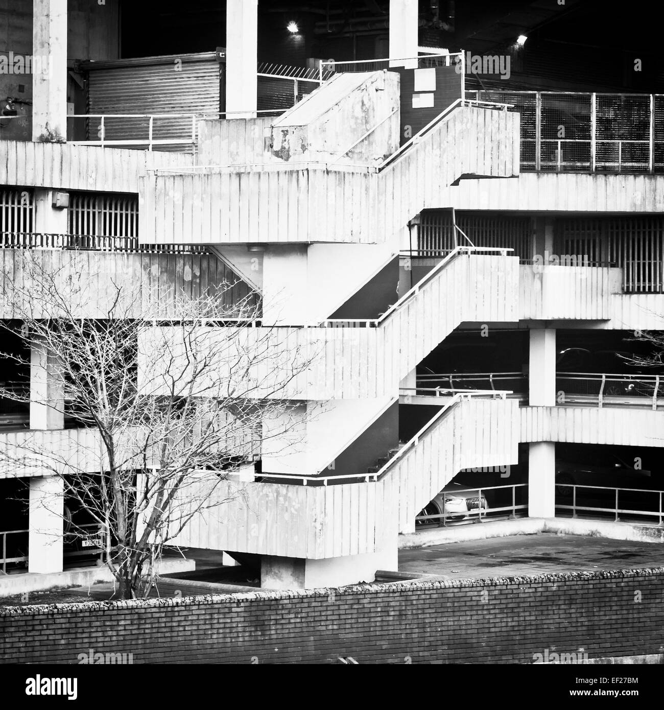Spiral stone staircase on the edge of a multi-storey car park Stock Photo