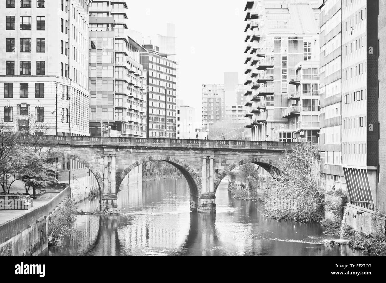 Bridge over a canal in Manchester with modern buildings Stock Photo