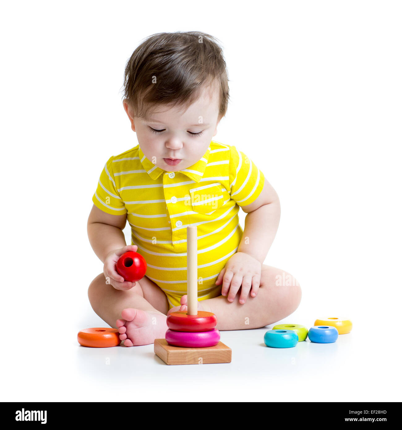 baby boy playing with colorful toy Stock Photo