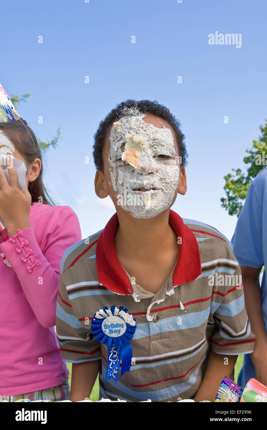 Child's face covered in icing Stock Photo Alamy