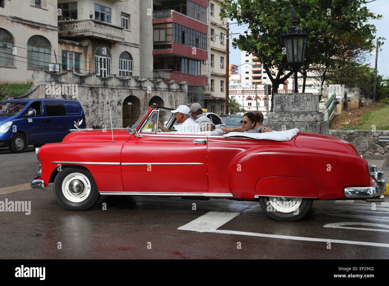 Old red American car coming out of the Hotel Nacional. Vedado, Havana, Cuba Stock Photo