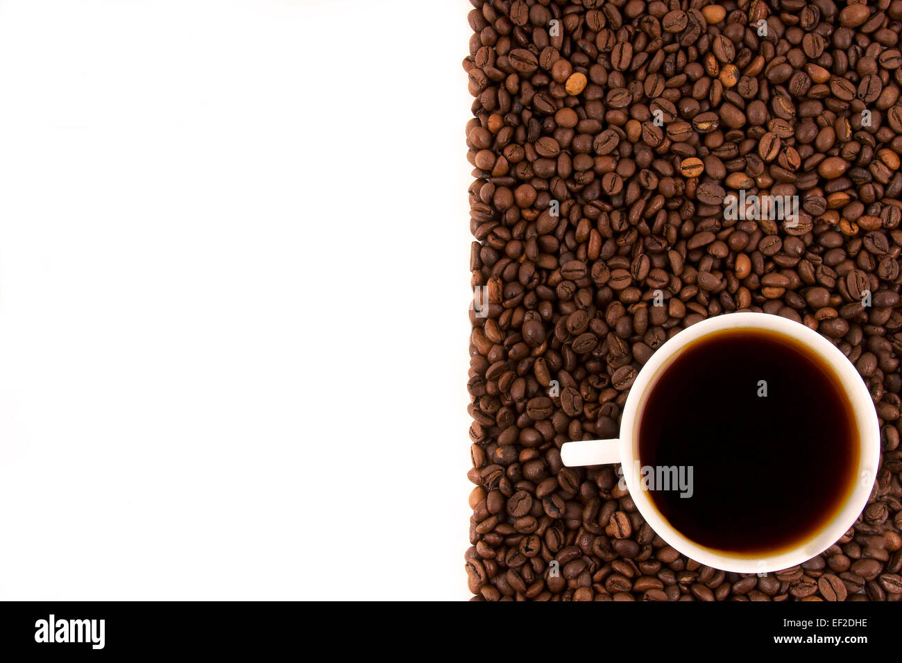 Coffee cup and beans on a white background Stock Photo - Alamy