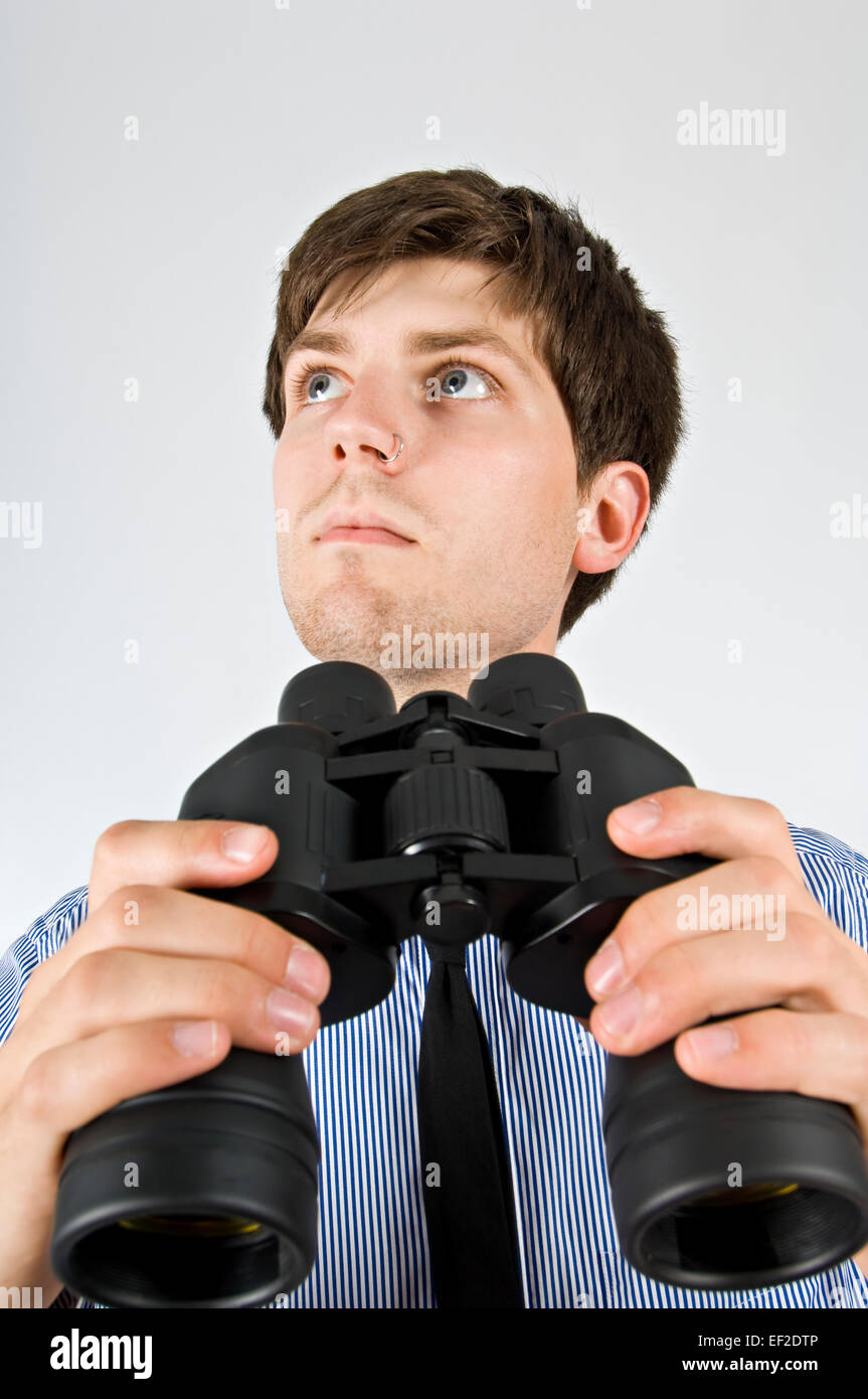 Man holding binoculars Stock Photo Alamy