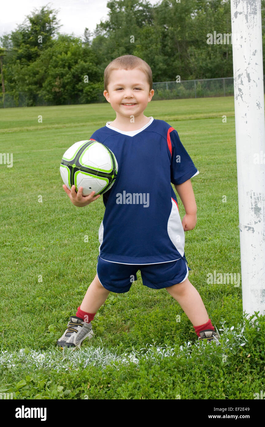 Young boy holding a soccer ball Stock Photo