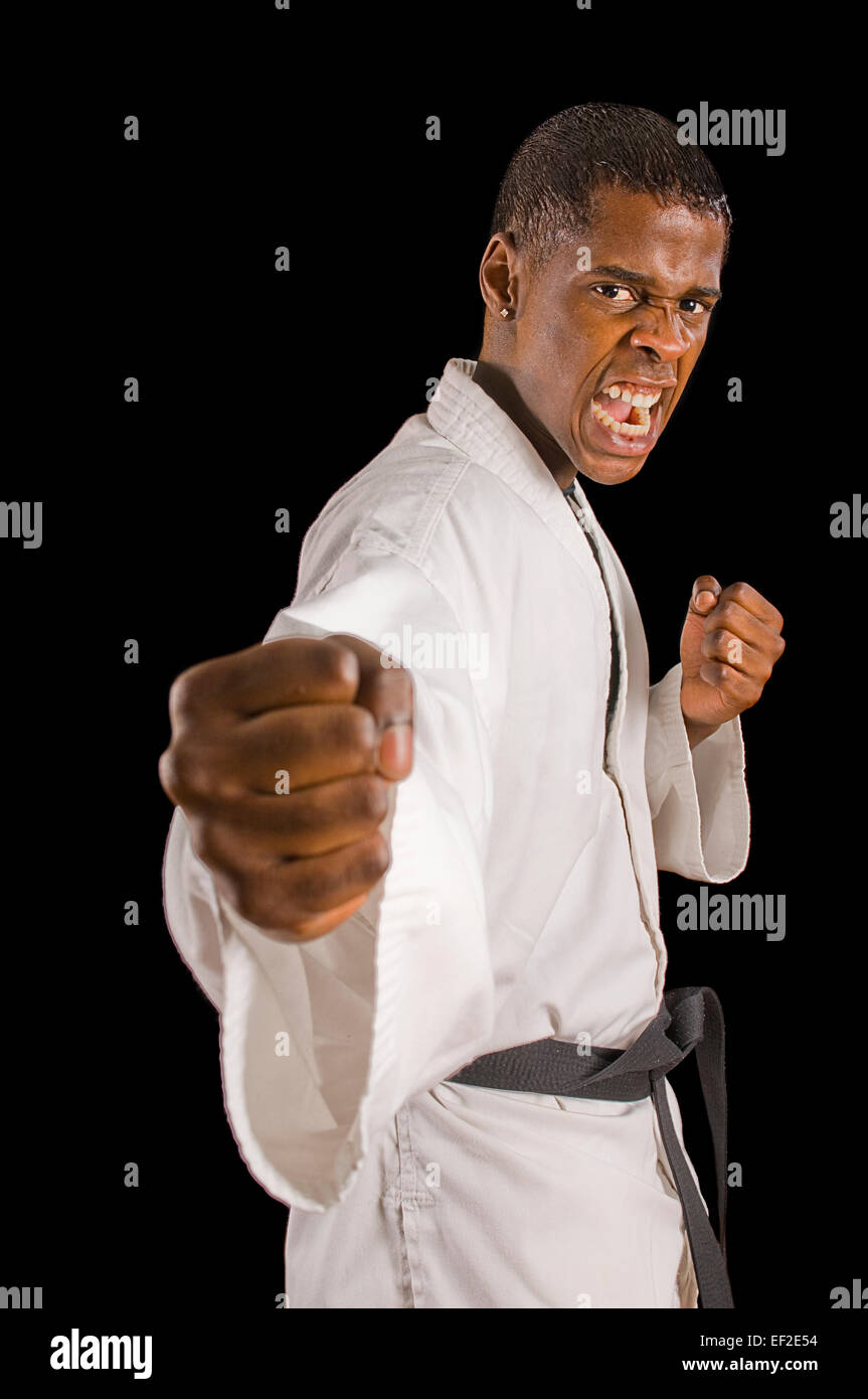 Young man practicing karate Stock Photo - Alamy