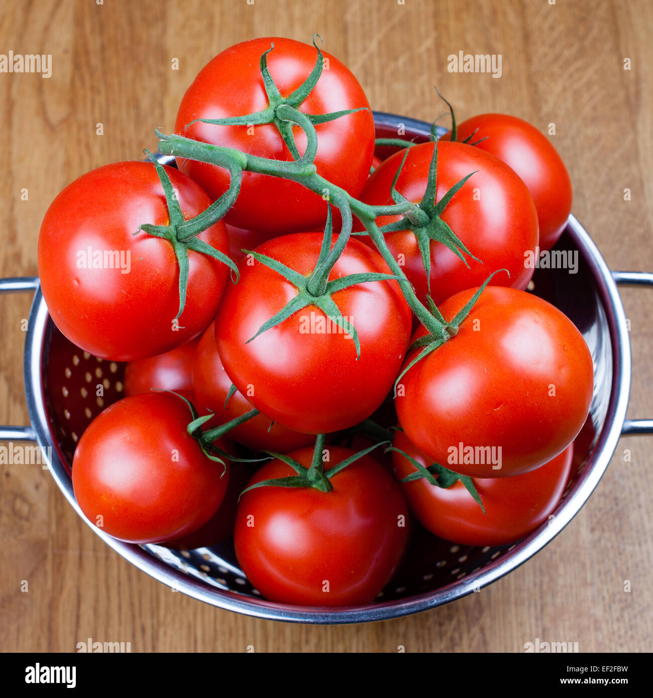 Tomatoes in a drying bowl. Stock Photo