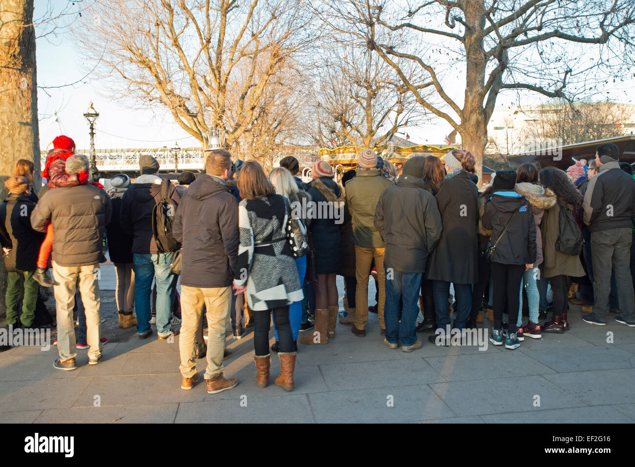 Rear view of People watching entertainers at the embankment London UK Stock Photo