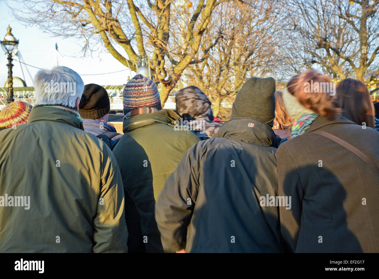Rear view of People watching entertainers at the embankment London UK Stock Photo