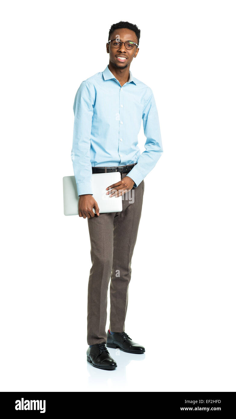 Happy african american college student standing with laptop on white background Stock Photo