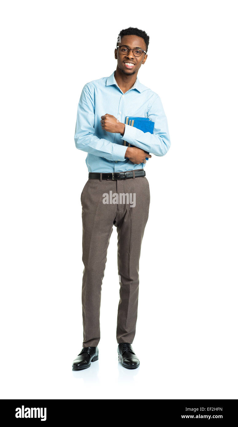 Happy african american college student standing with books in his hands on white background Stock Photo
