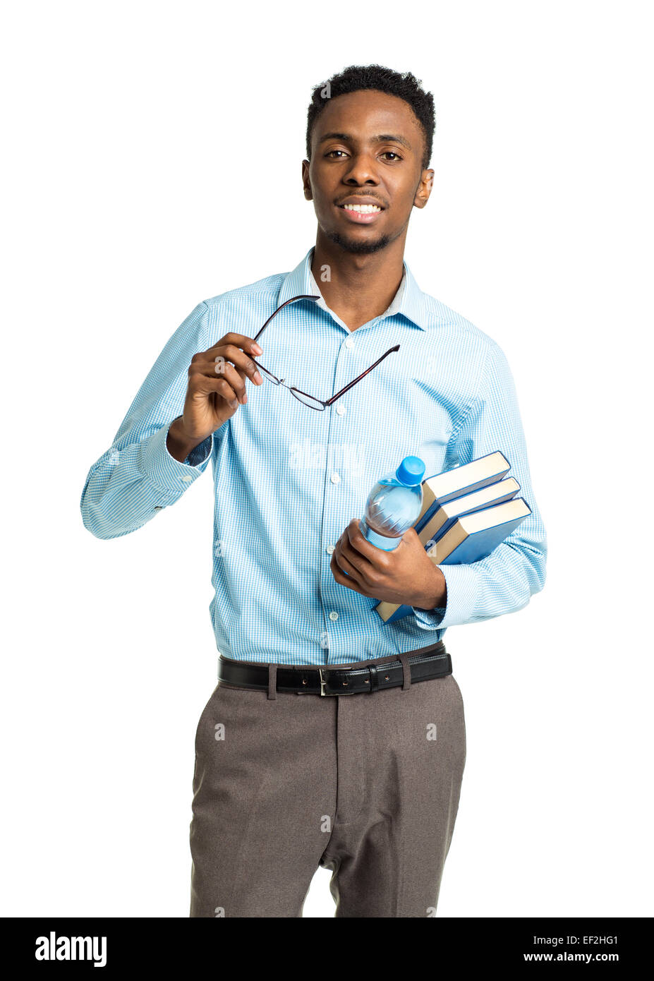 Happy african american college student standing with books and bottle of water in his hands on white background Stock Photo