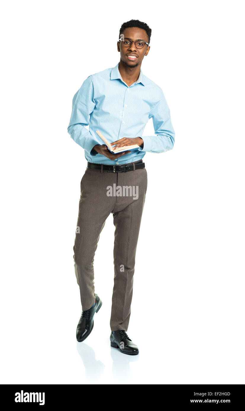 Happy african american college student standing with book on white background Stock Photo