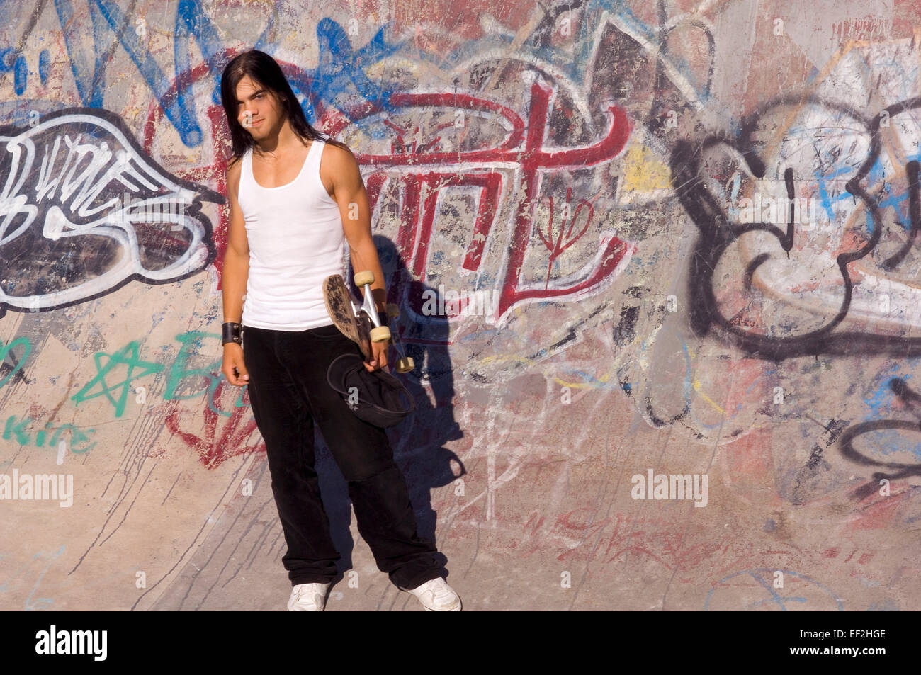 Skateboarder hanging around at a skate park Stock Photo