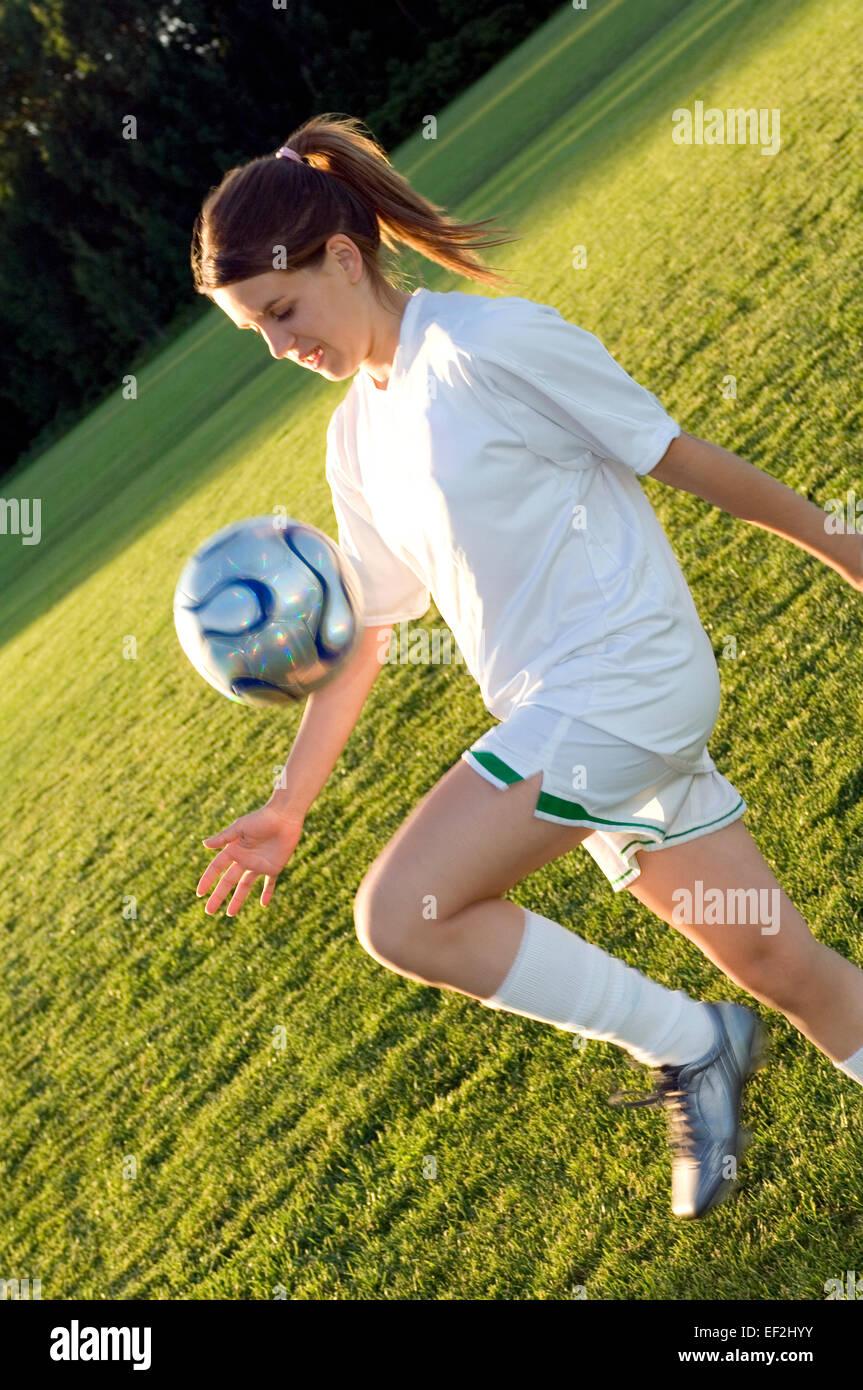 Girl playing soccer Stock Photo