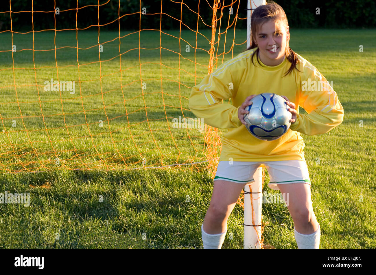 Girl on a soccer field Stock Photo