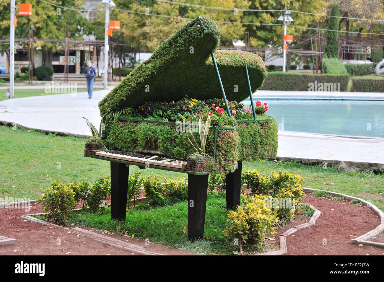 Grand piano made of hedge with flowers growing inside, Yerevan, Armenia Stock Photo