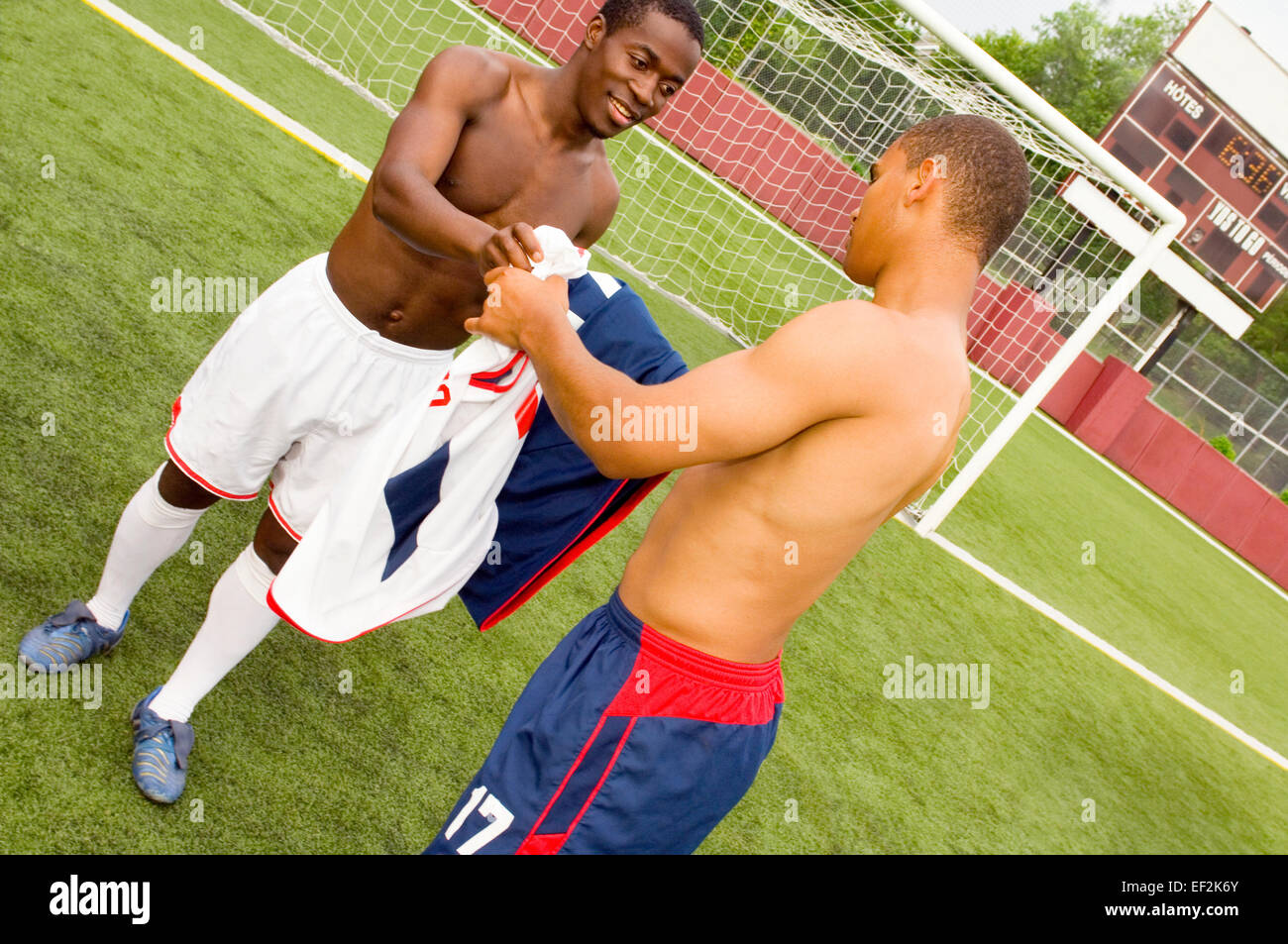Two soccer players switching jerseys Stock Photo Alamy