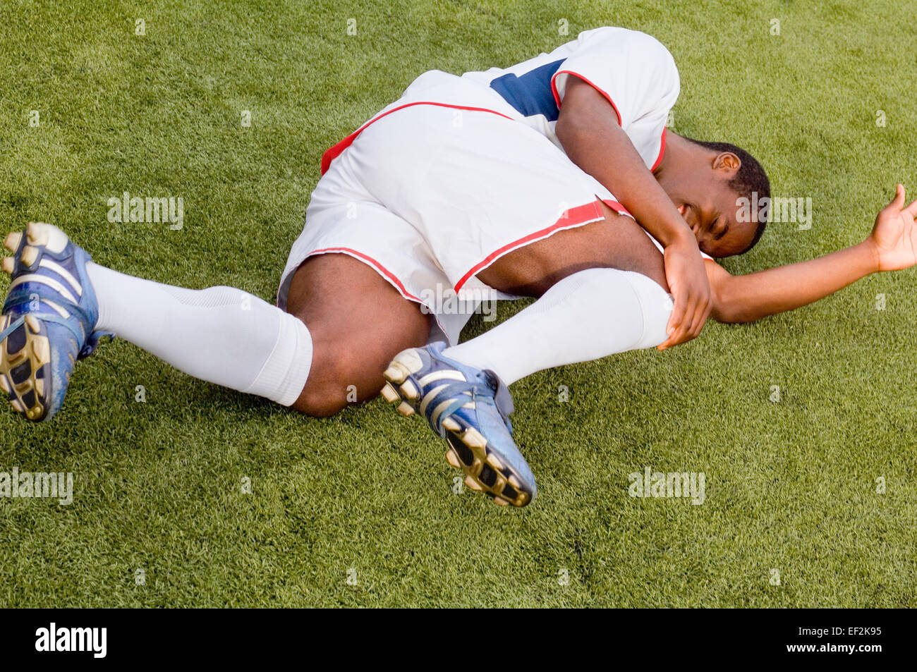 Injured soccer player on field Stock Photo Alamy