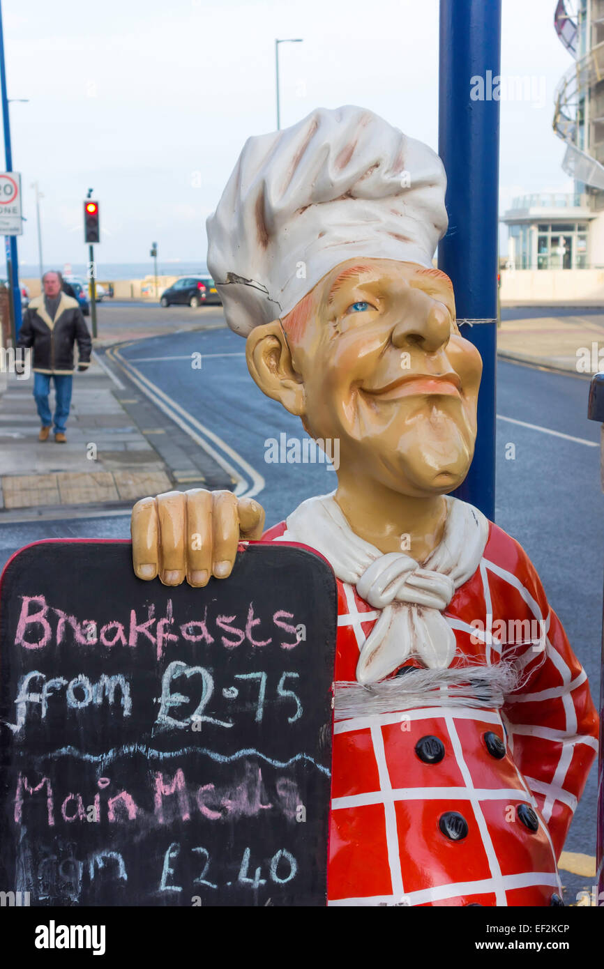 Chef manikin outside a café in Redcar with a blackboard advertising  cheap food Breakfasts £2.75 Main Meals from £2.40 in 2015 Stock Photo