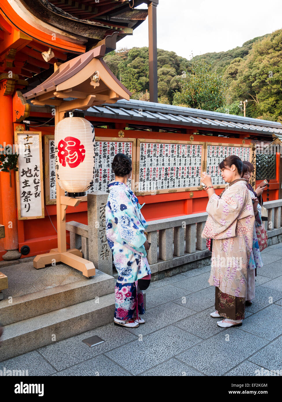 Women making offerings at Kiyomizu-dera Buddhism temple Stock Photo