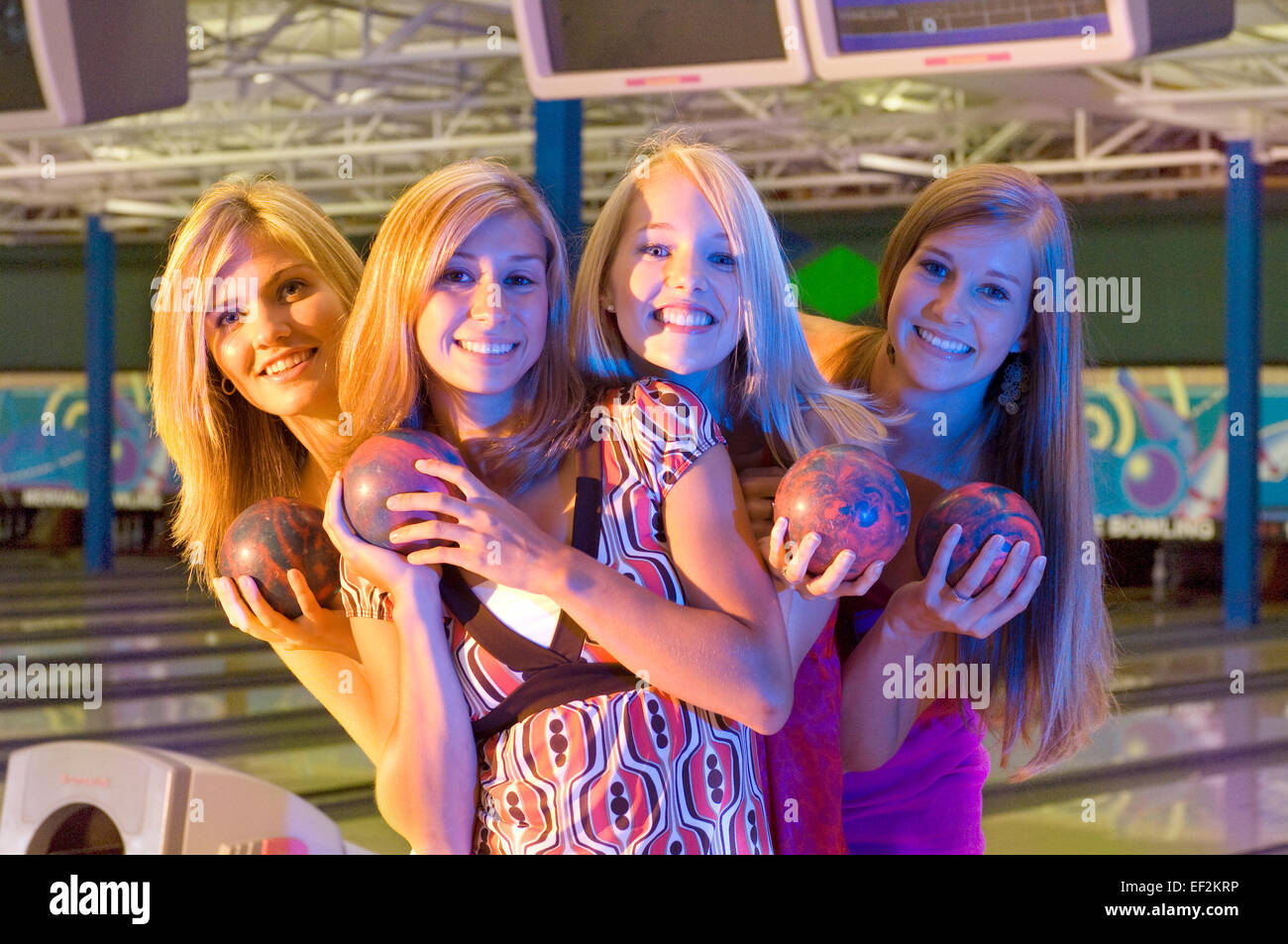 Group of girl friends bowling Stock Photo