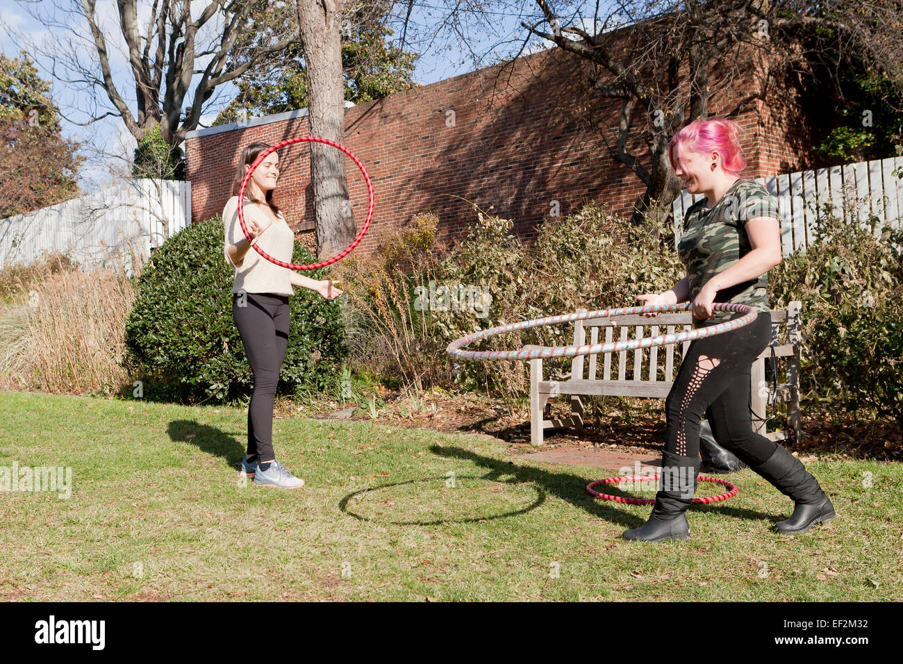 Young women exercising with hoola hoops - USA Stock Photo