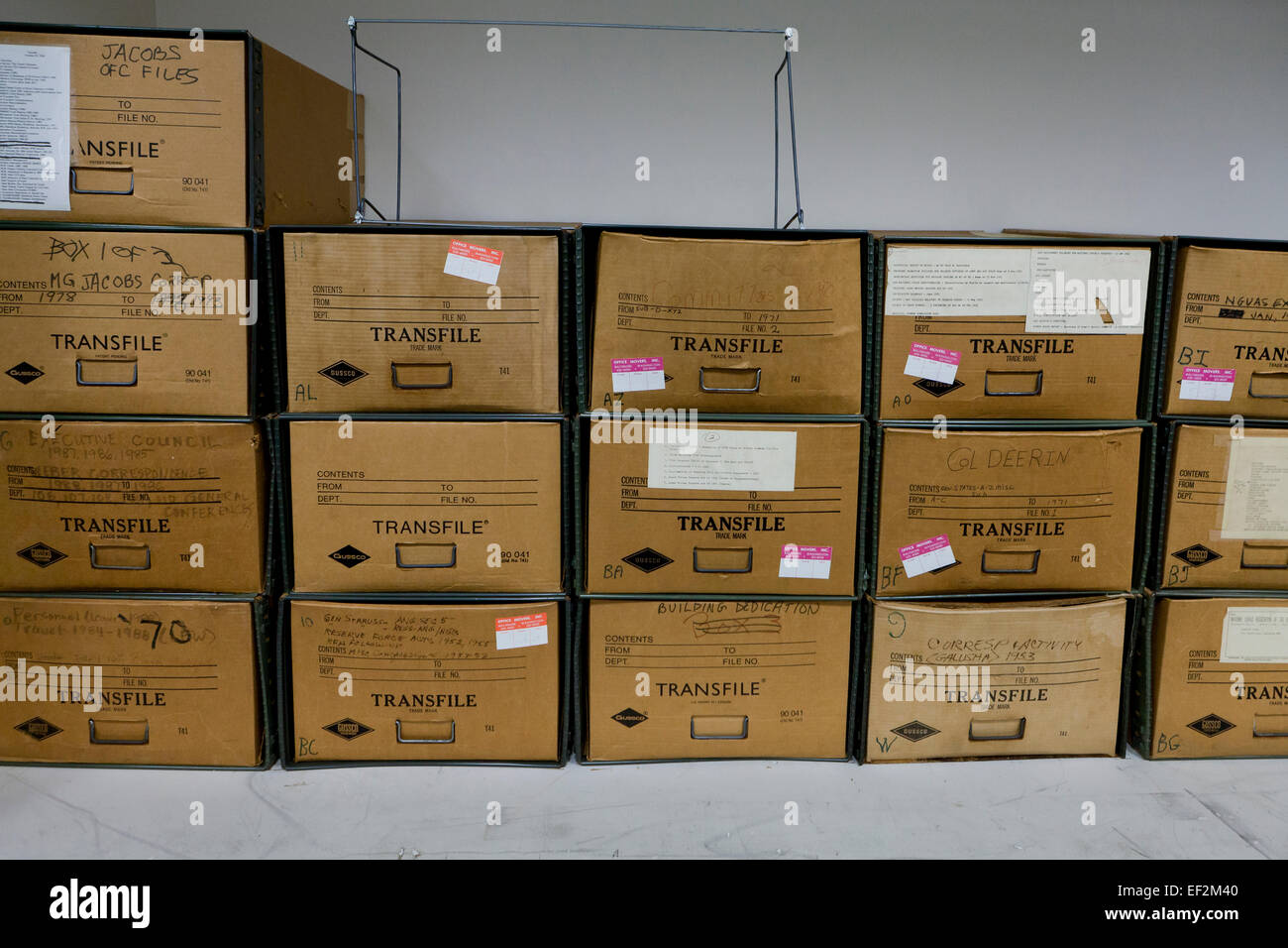 File storage boxes stacked in office file room - USA Stock Photo