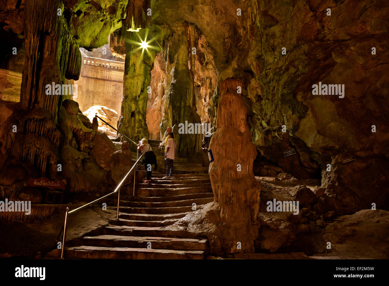 TH00349-00...THAILAND - Visitors on the stairs that access the underground caverns of Khao Luang near Phetchaburi. Stock Photo