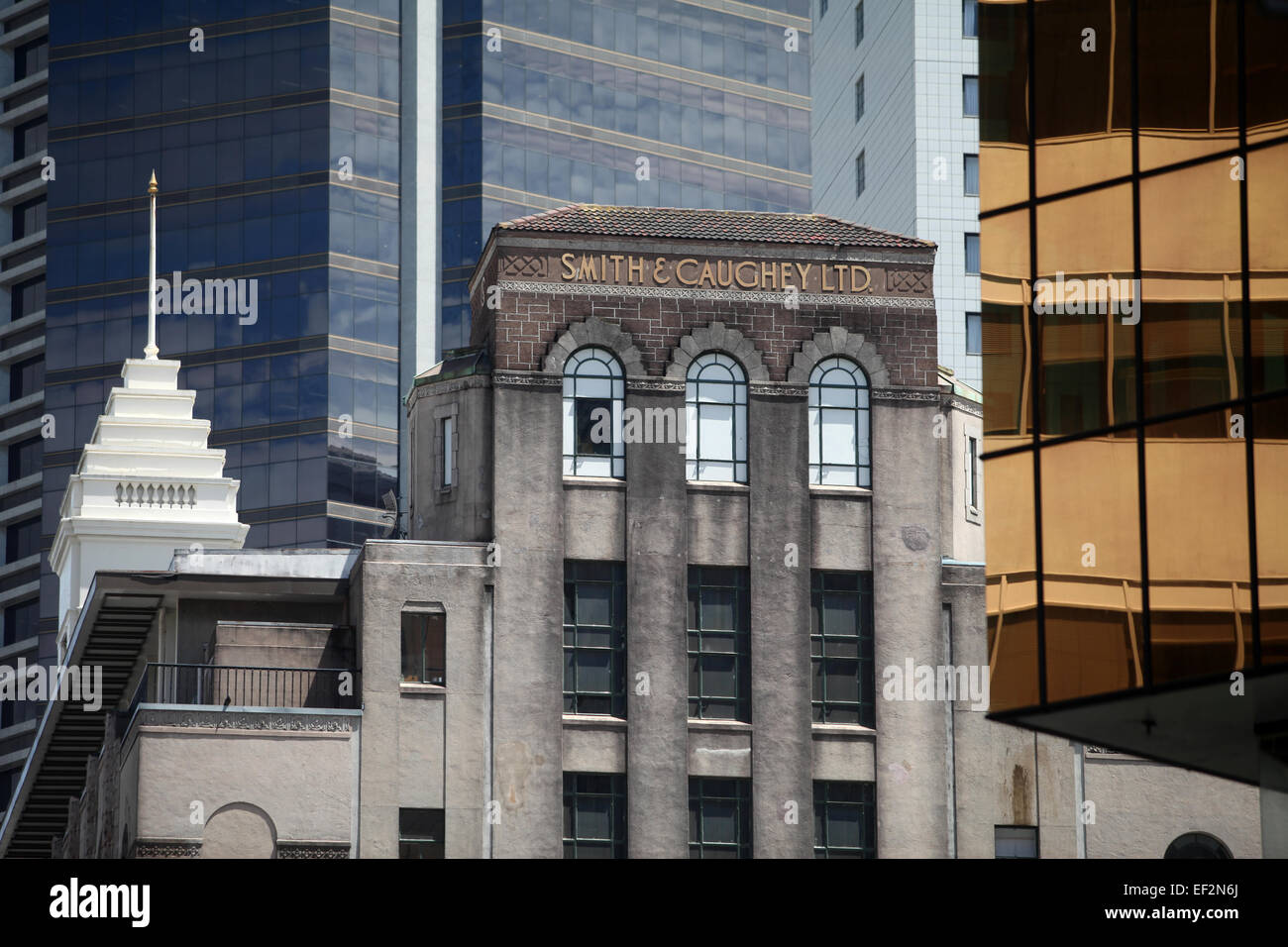 Historic Smith and Caughy building with a backdrop of modern offices