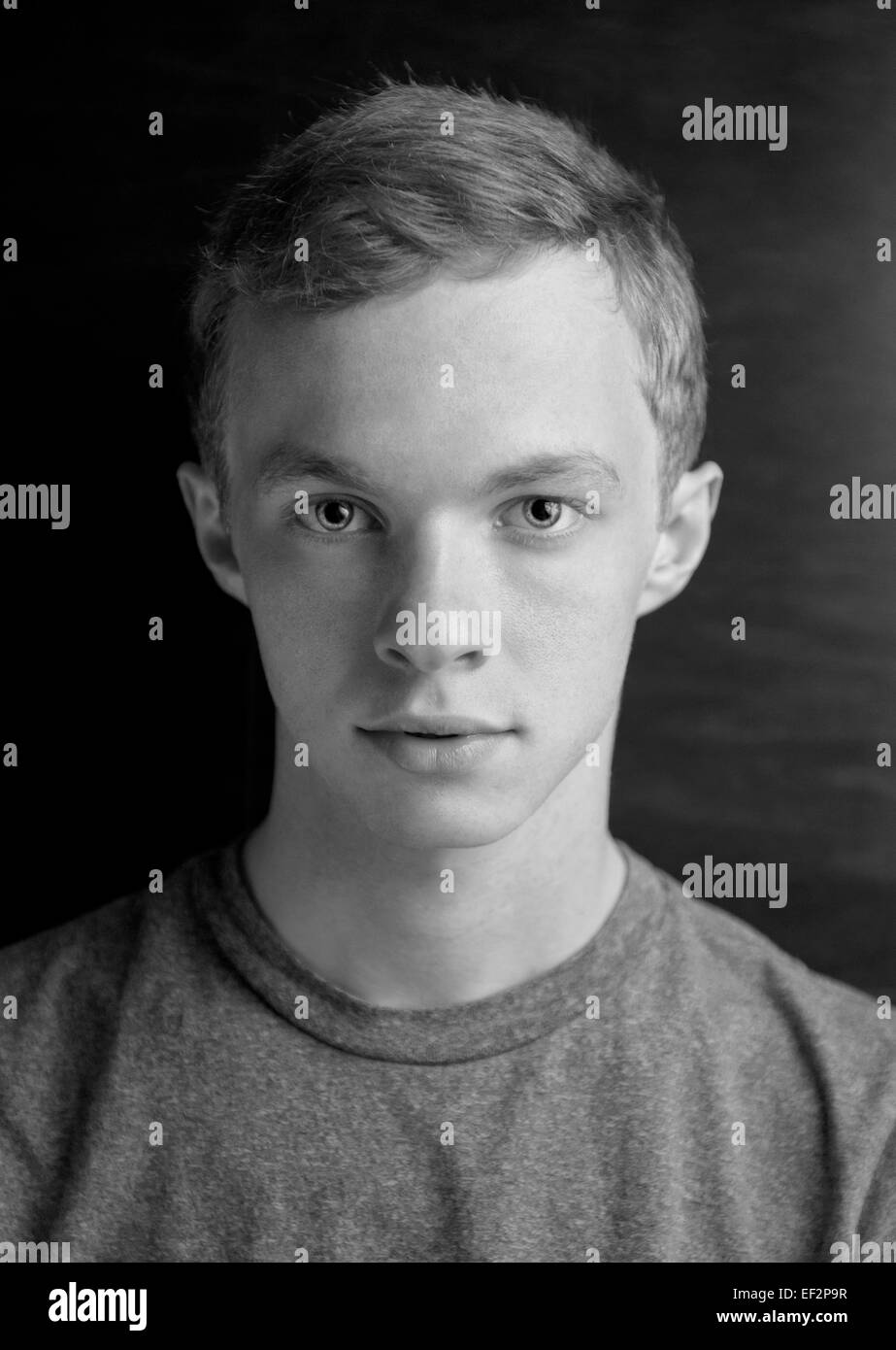 A head shot portrait of a young man 19 nineteen years old (black and white photo) White Caucasian Male Stock Photo