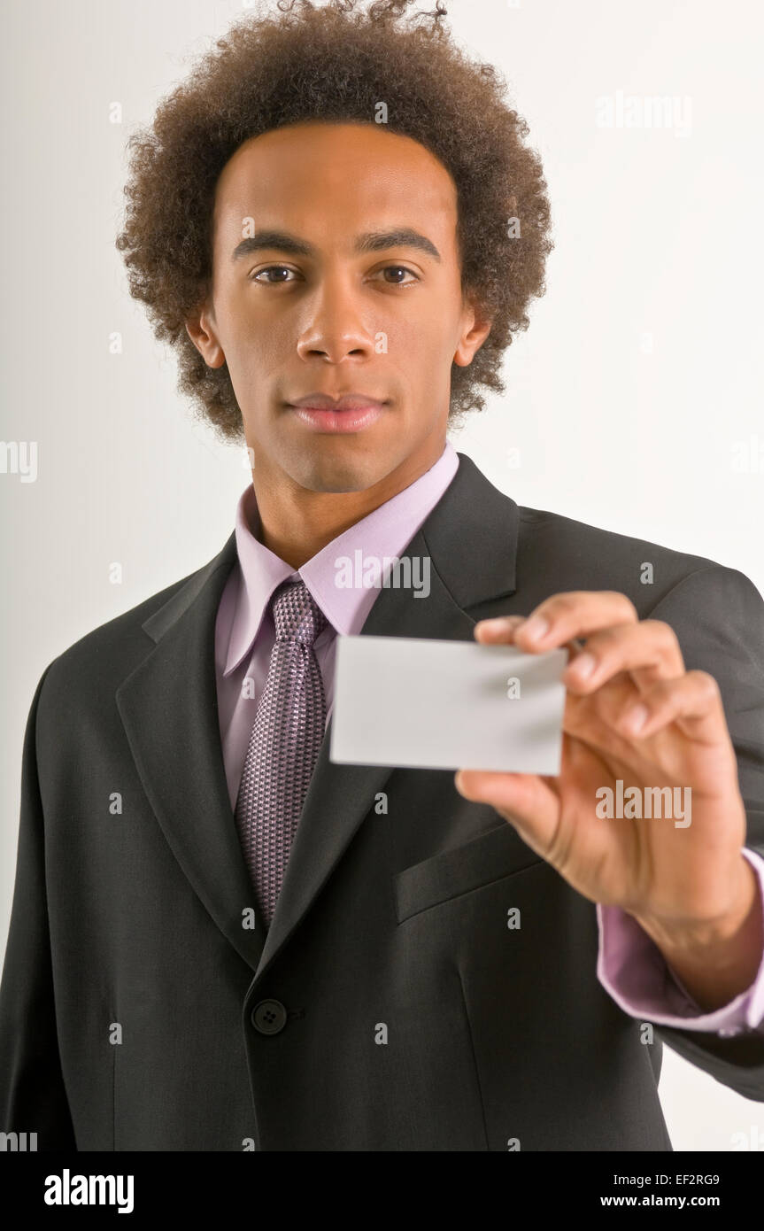 Businessman holding a business card Stock Photo