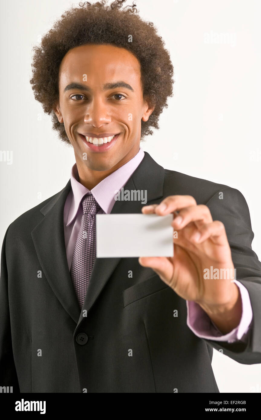Businessman holding a business card Stock Photo