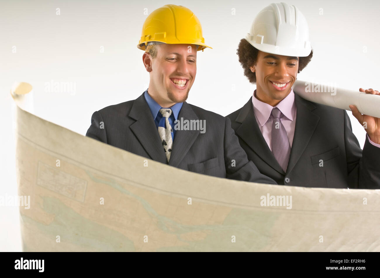 Two architects looking at blueprints Stock Photo