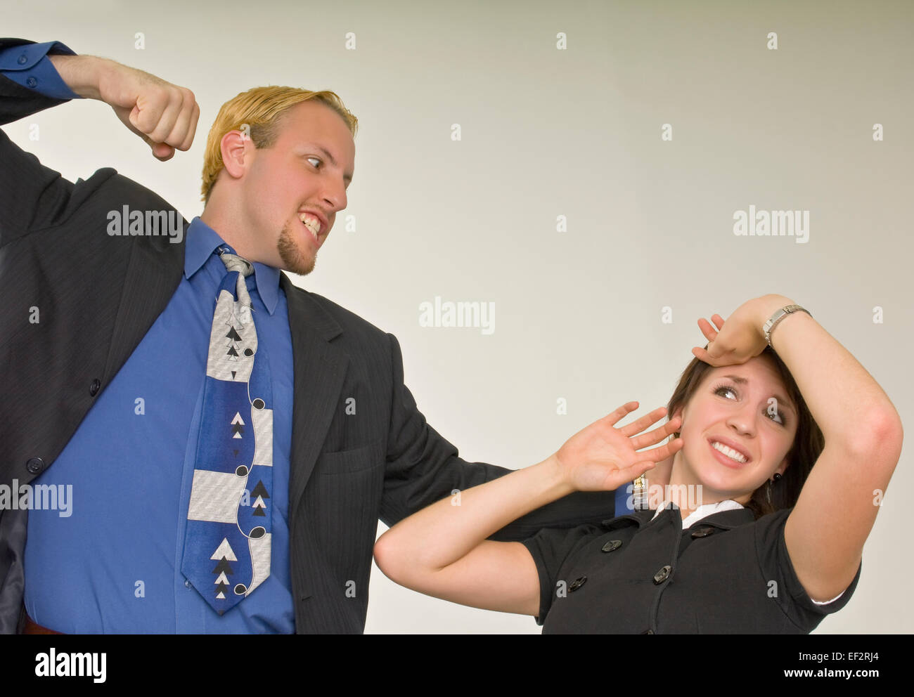 Man about to punch woman Stock Photo Alamy