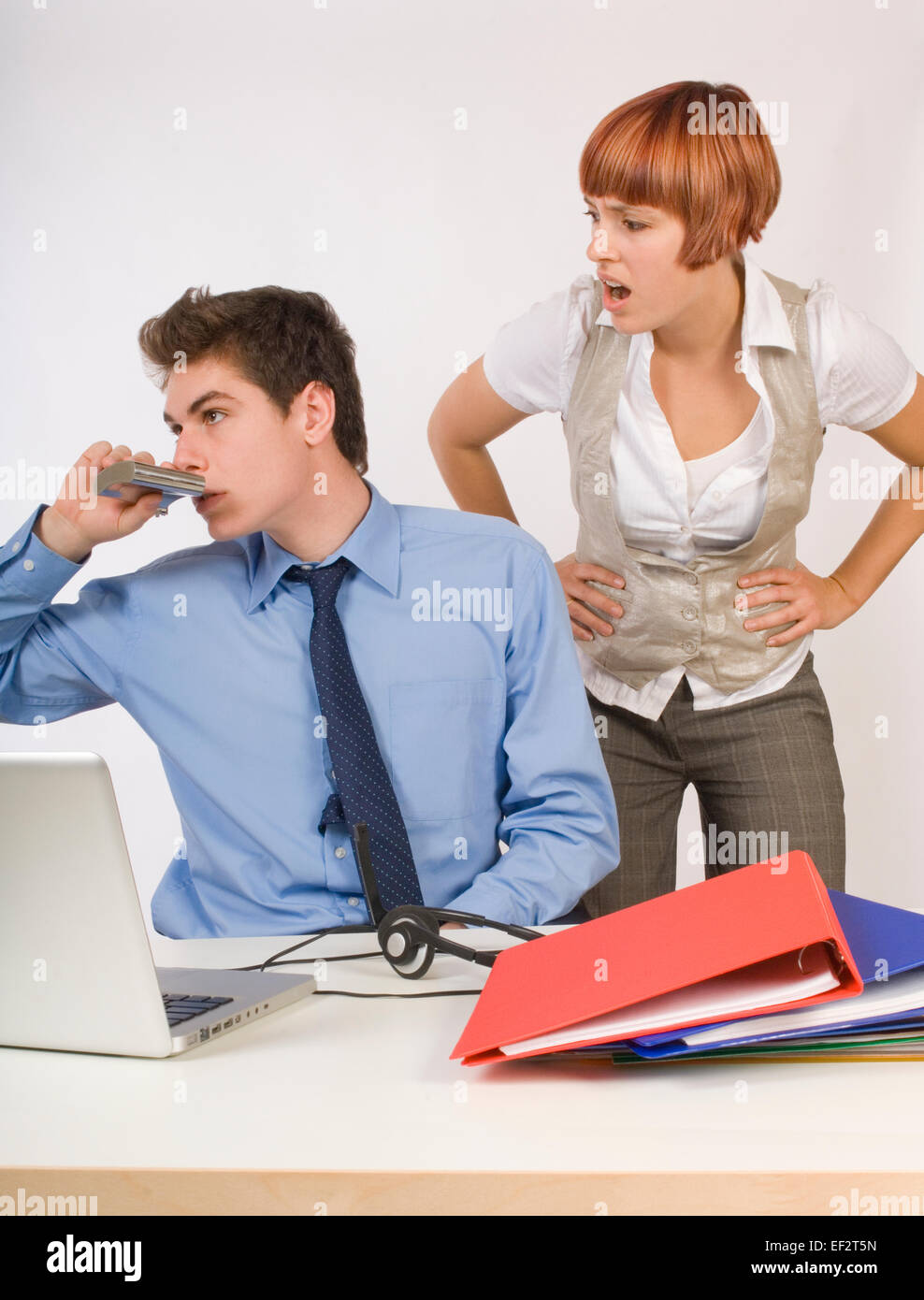 Businessman drinking from a flask while at work Stock Photo Alamy