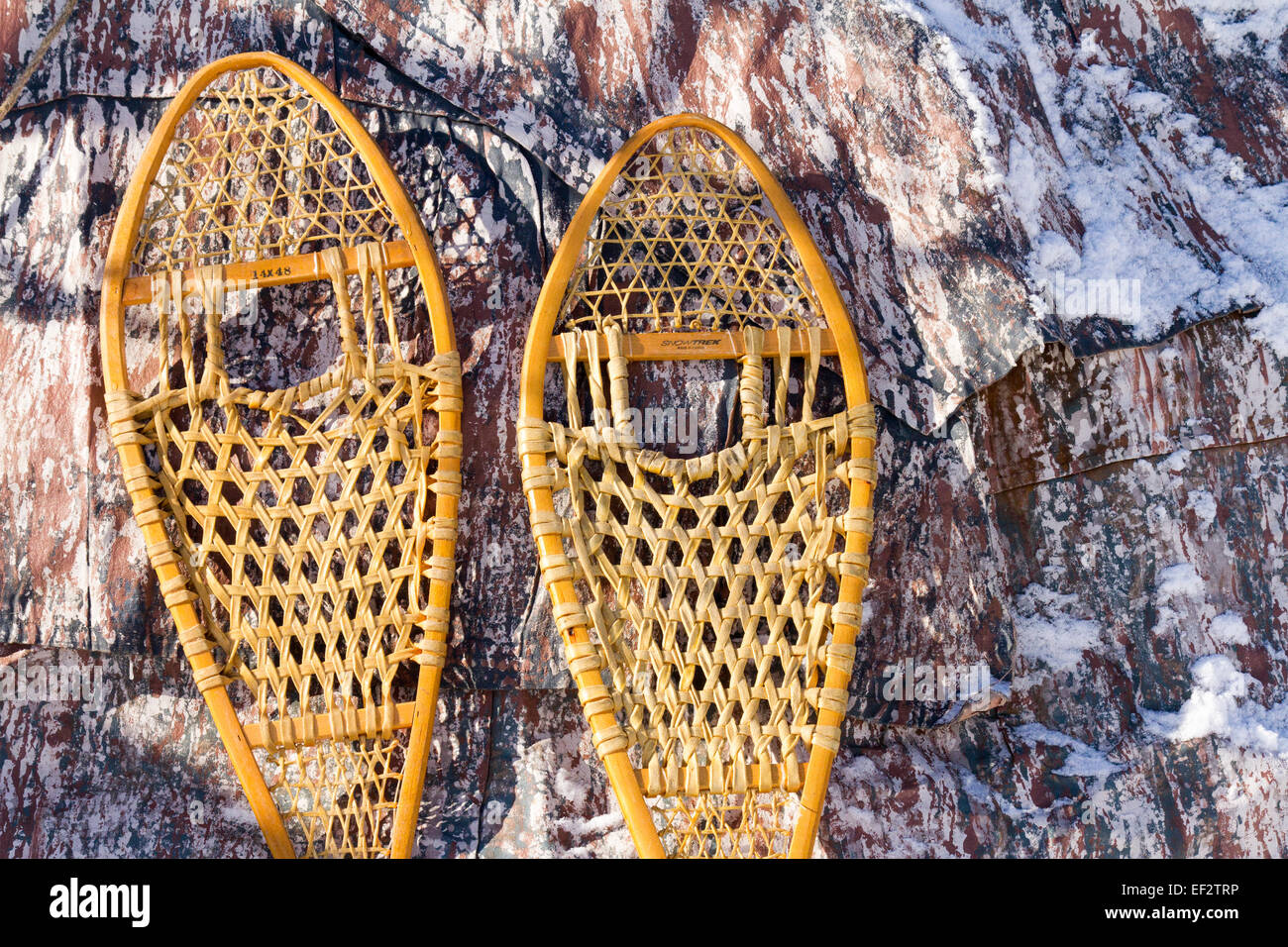 Pair of snowshoes leaning up against a wigwam. Stock Photo