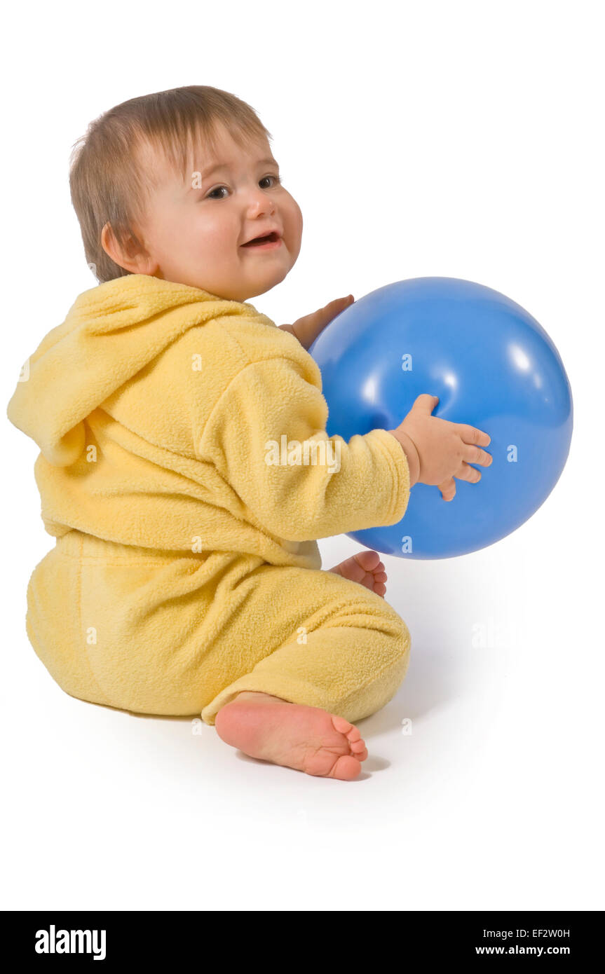 Toddler playing with a ball Stock Photo Alamy