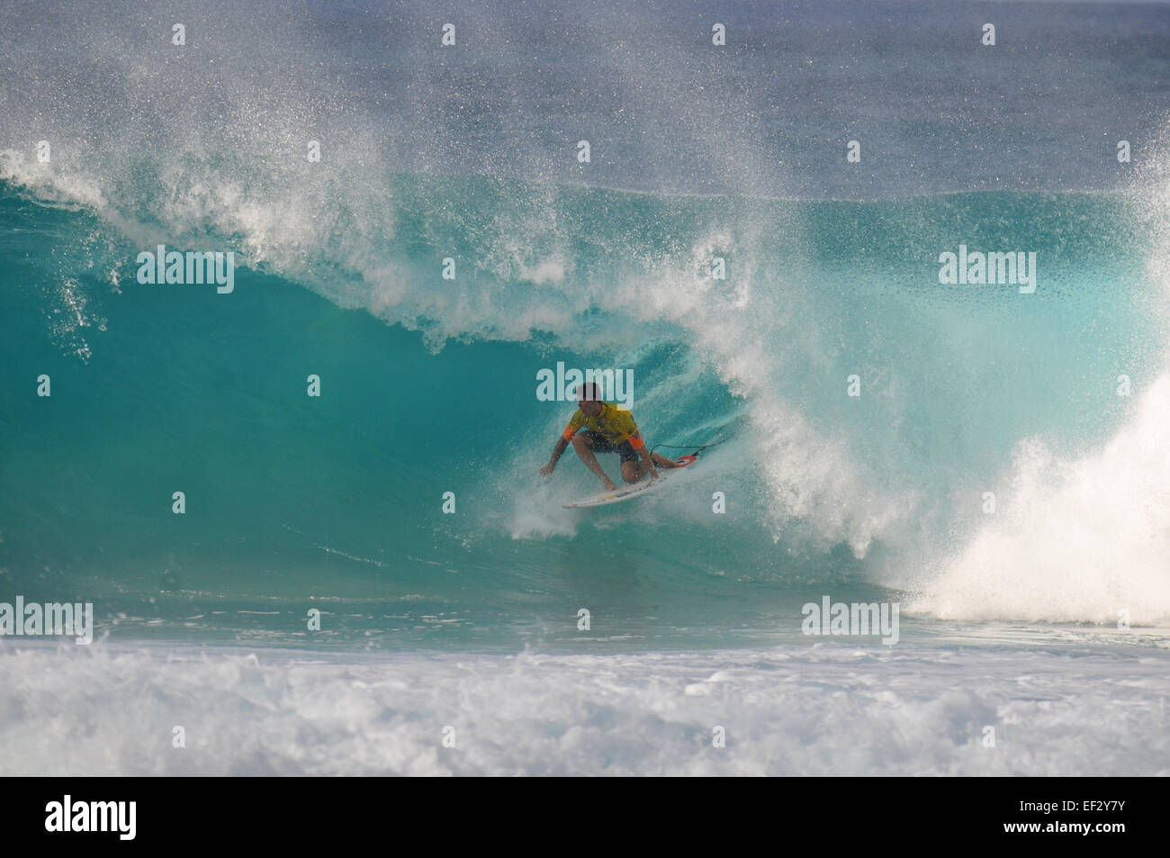 Brazilian pro-surfer, Gabriel Medina, rides the 'backdoor' and scores a 10 at the 2014 Pipemasters, Banzai Pipeline, Hawaii Stock Photo
