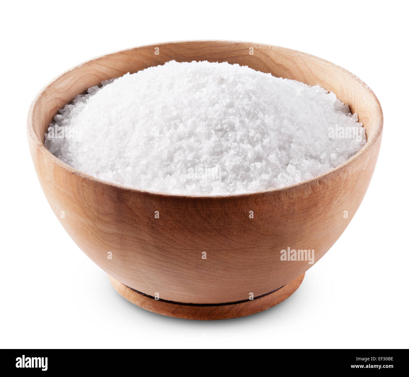 Sea salt in wooden bowl on white background with clipping path Stock Photo