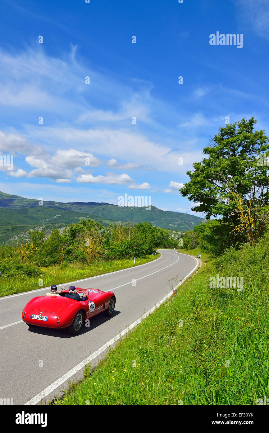 Jaguar Special, 1950, classic car, racing car, auto car race Mille Miglia, 1000 Miglia, on road through hilly landscape with Stock Photo
