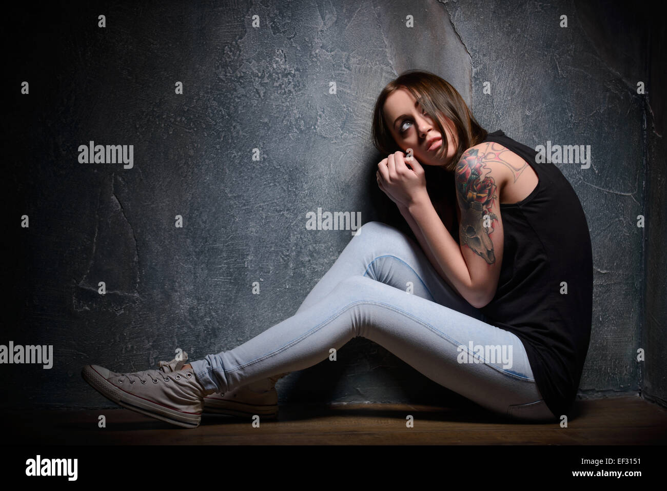 Victim of domestic violence in the cellar Stock Photo - Alamy