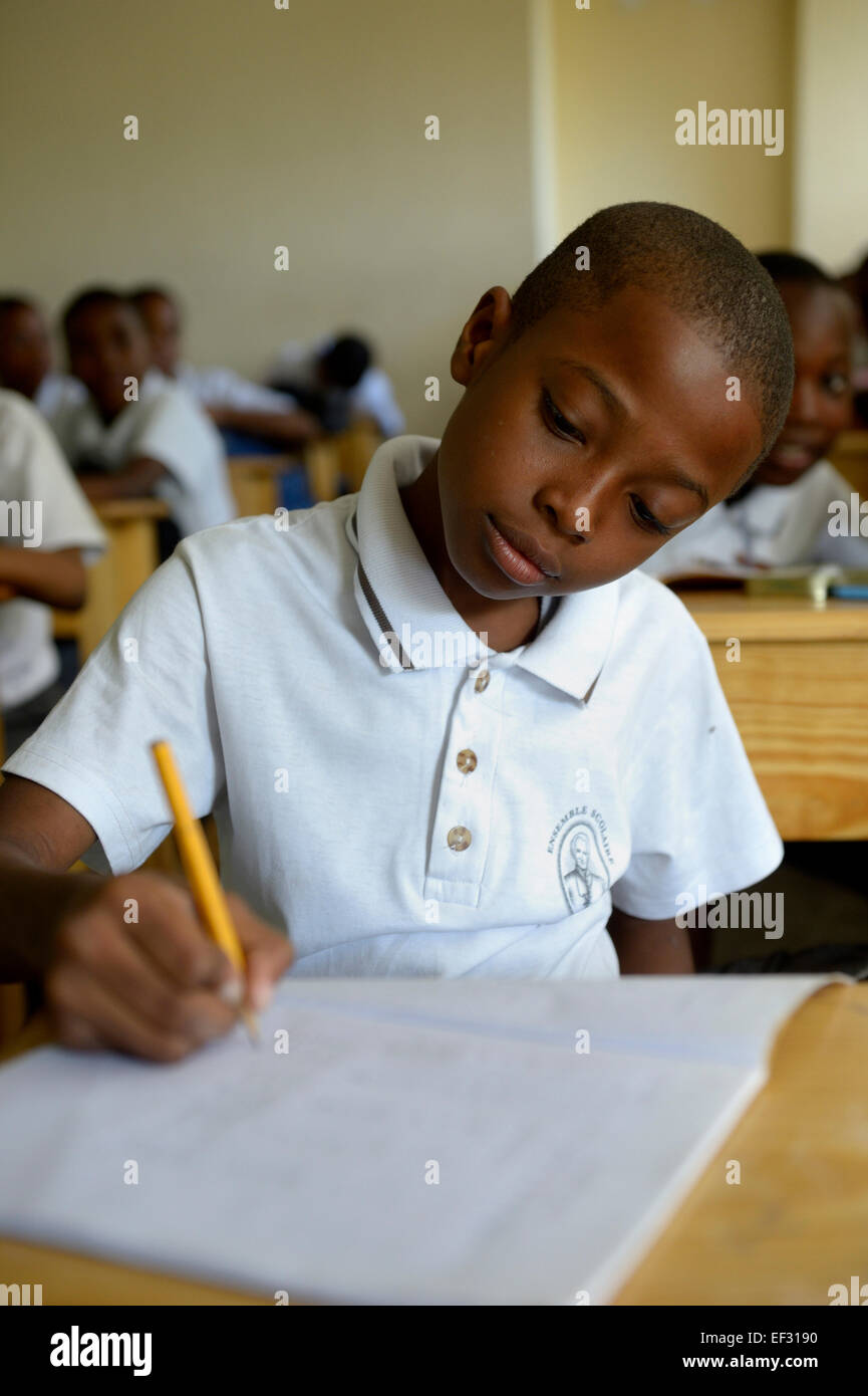 Schoolboy, 10 years, class at the Basile Moreau Primary School, Carrefour, Port-au-Prince, Ouest Department, Haiti Stock Photo