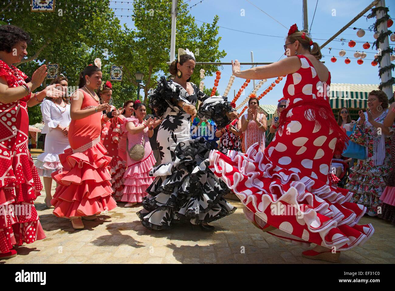 Flamenco dancers at the Feria de Abril, Seville, Andalucía, Spain Stock Photo