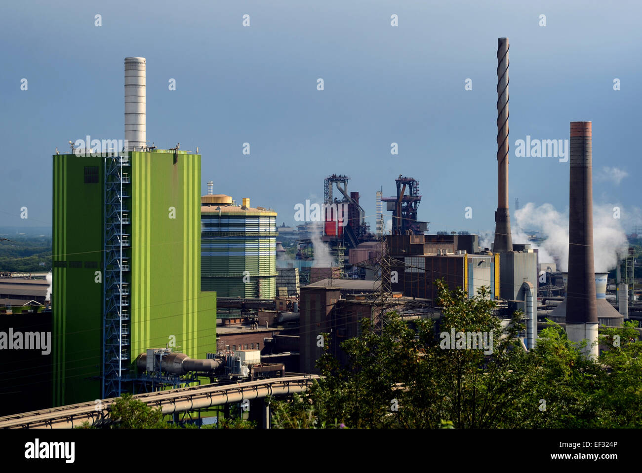 View from Alsumer Berg lookout, a 70m high dump, on the gas heating plant Hamborn (L) and the ThyssenKrupp steelworks with the furnaces in Duisburg-Bruckhausen, North Rhine-Westphalia. Photo from 31st August 2014. Stock Photo