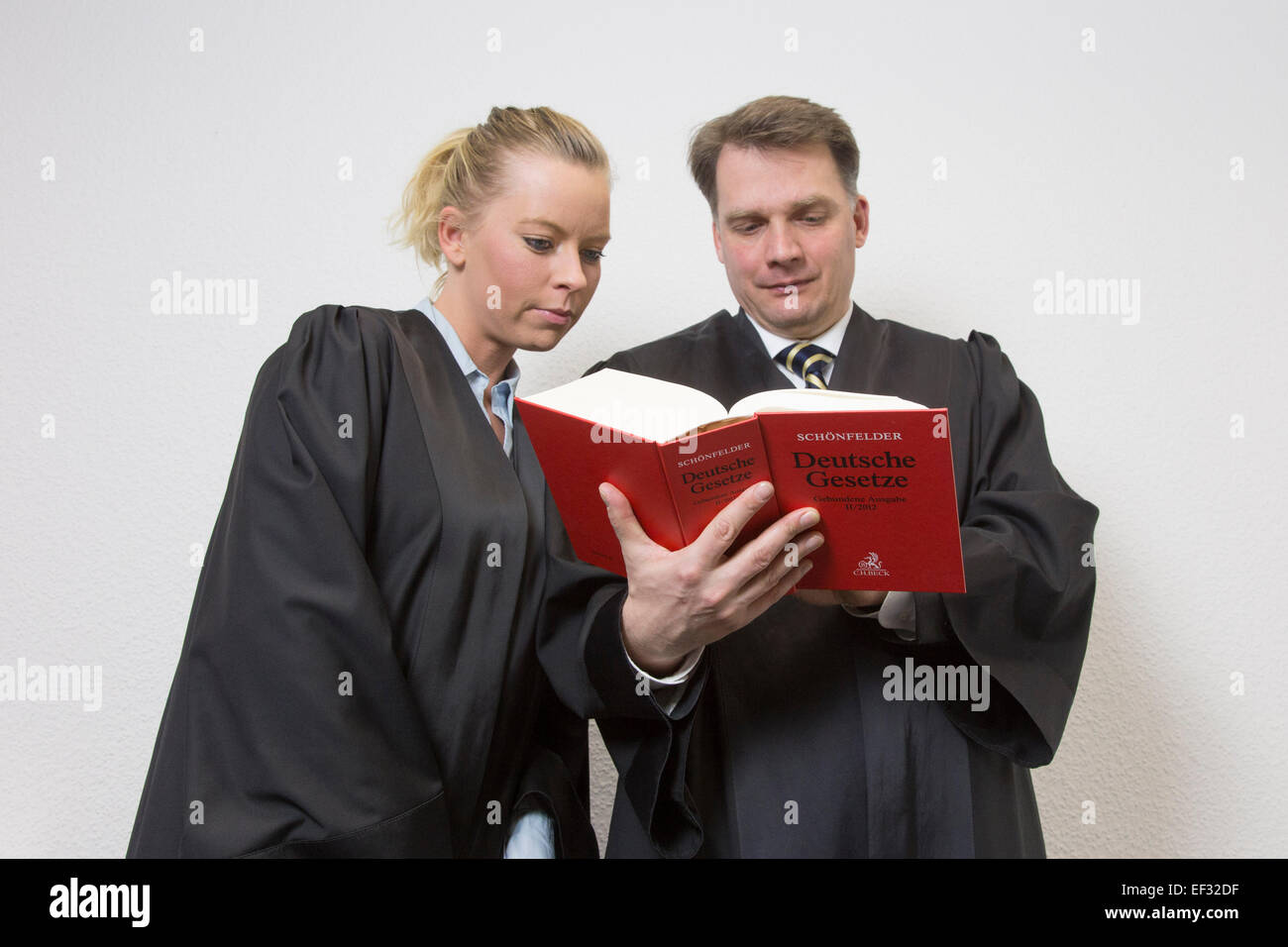 Advocates reading a statute book, 15 January 2015. Stock Photo