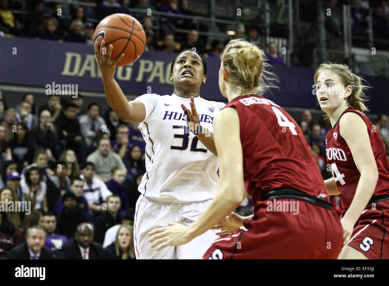 Jazmine Davis (32) drives to the hoop against Stanford defenders. The