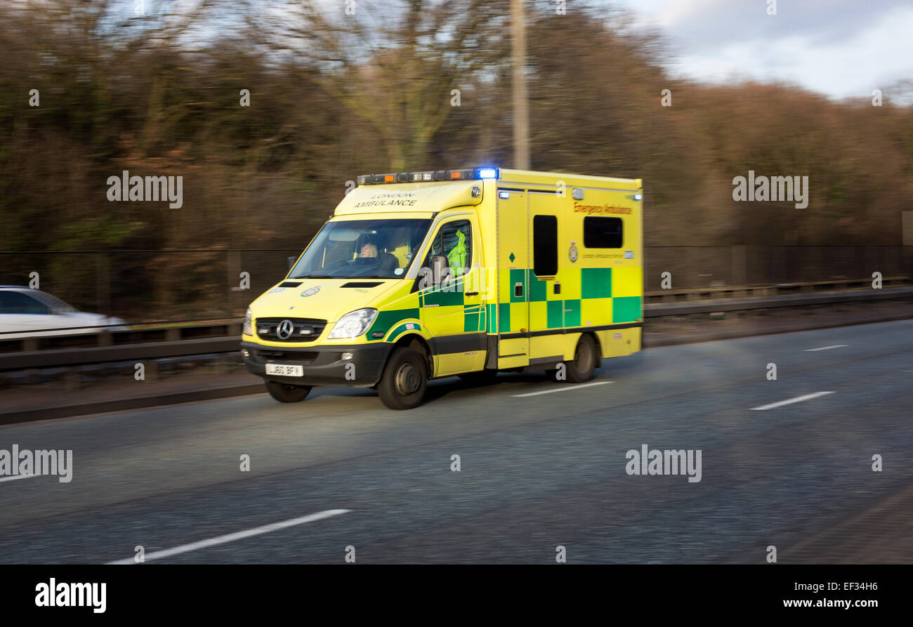 Ambulance blue light flashing emergency rushing Stock Photo Alamy