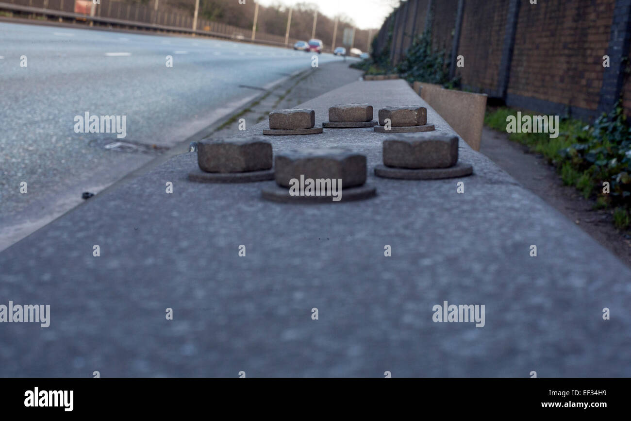 Bolts on crash barrier beside dual carriageway Stock Photo
