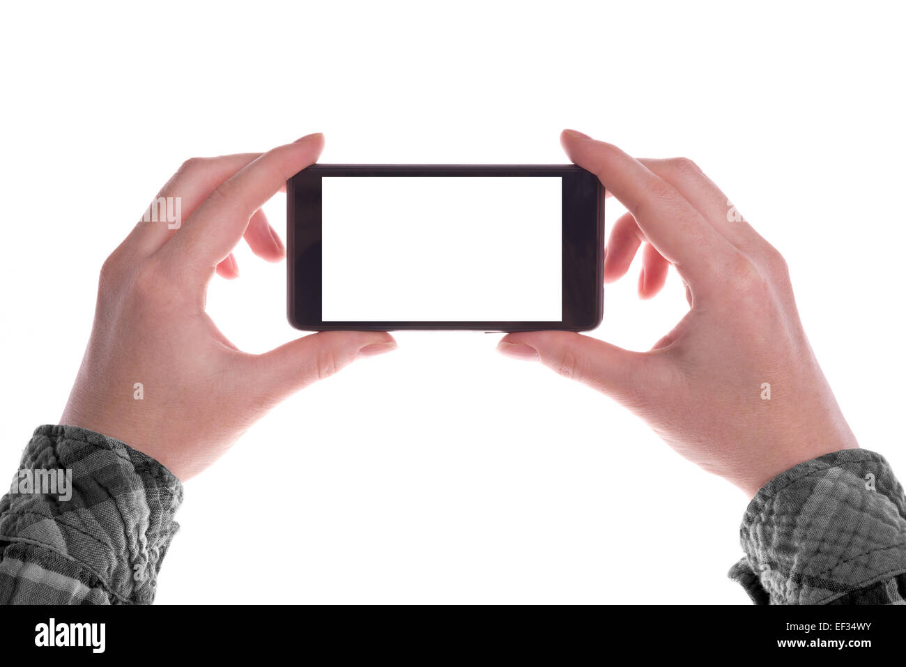 Hands holding Mobile Smartphone Device in Vertical Position with Blank White Screen as Copy Space isolated on white background Stock Photo
